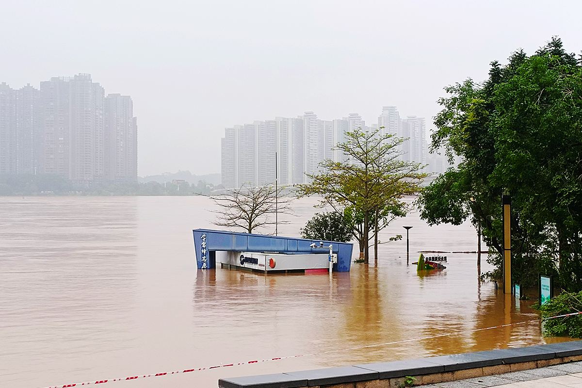 Екологічні проблеми Зіна клімату Китай Повінь Гуандун Фото